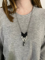 Herringbone design with shiny black necklace